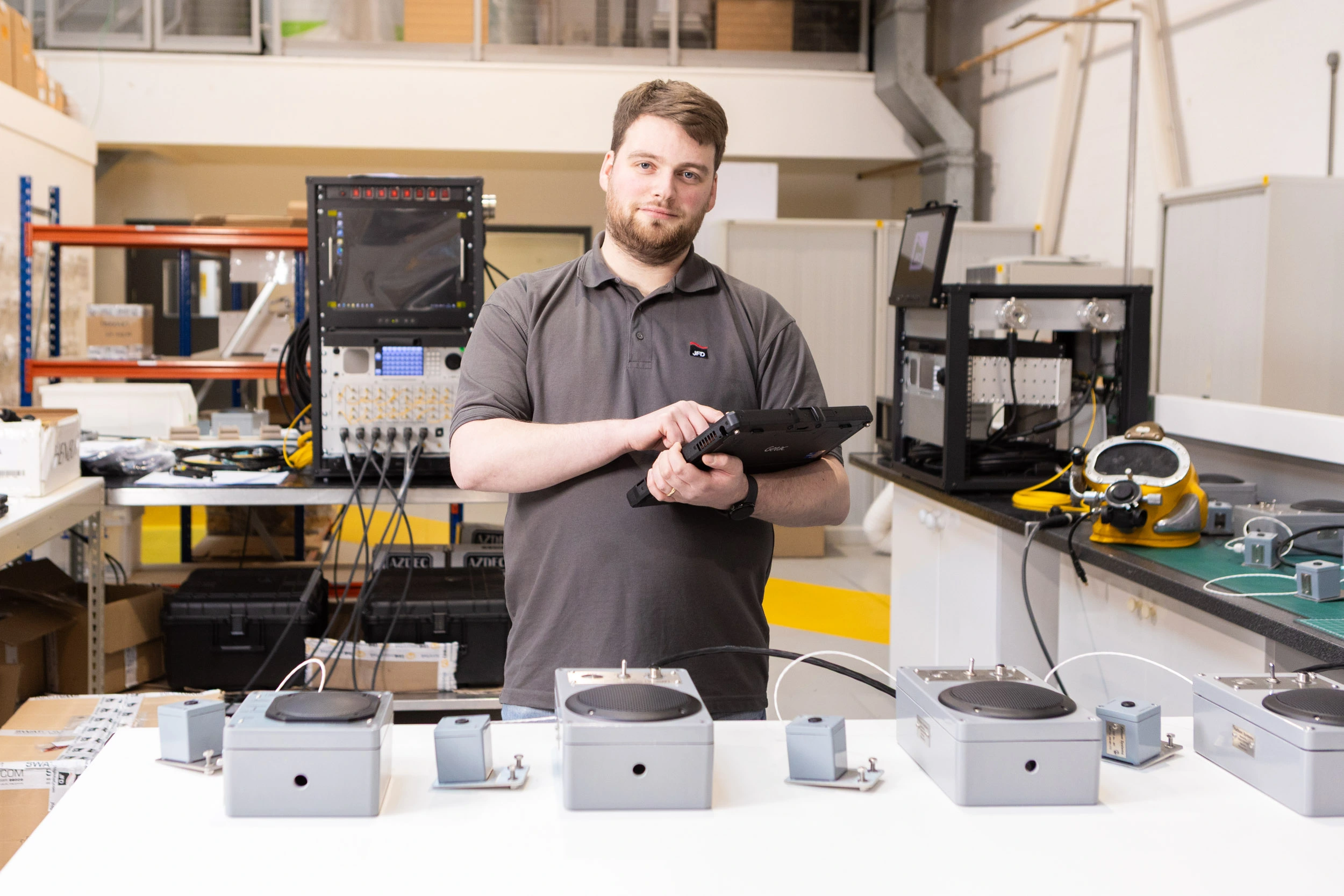 Young man working with electronic equipment.